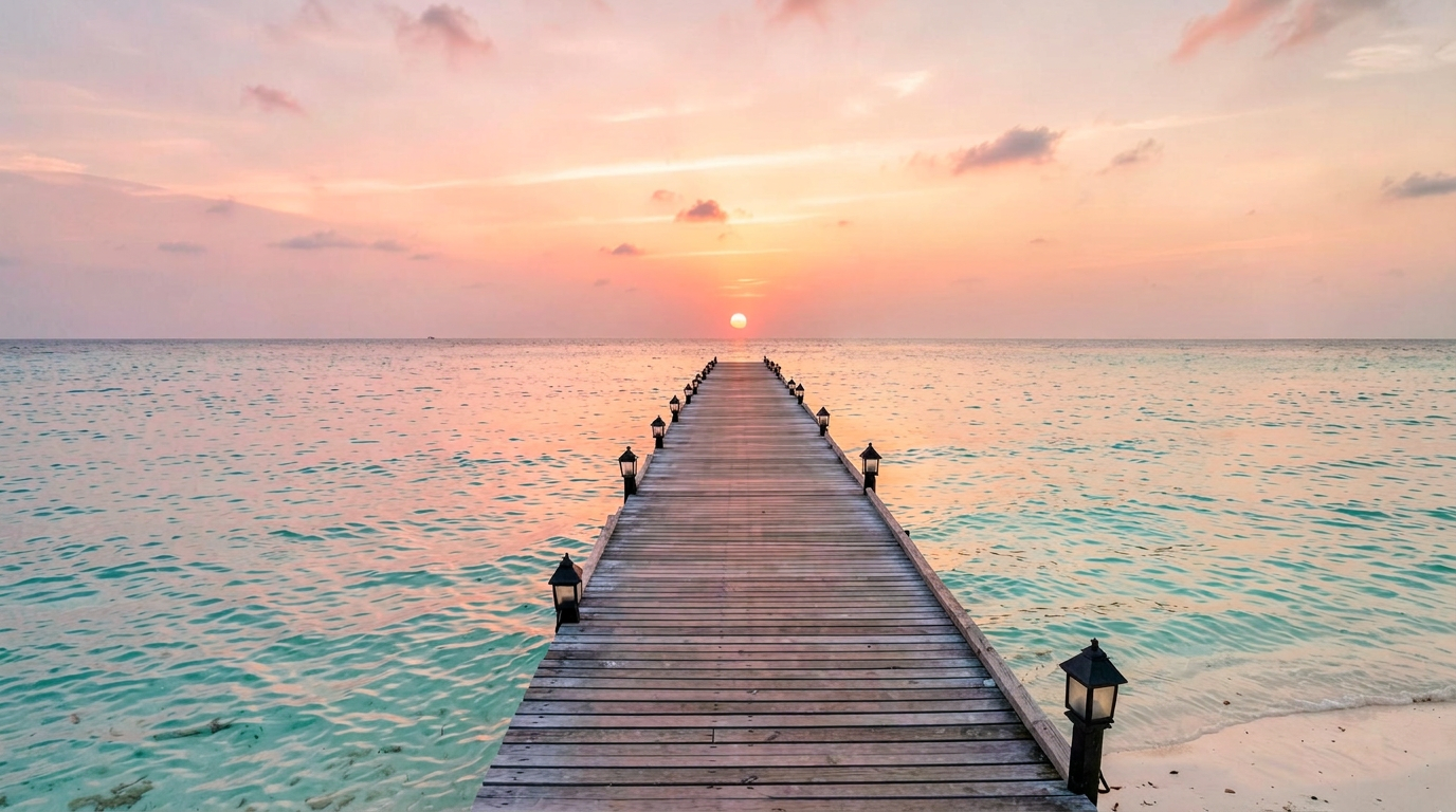 Calm turquoise Maldives ocean at sunset with a wooden pier